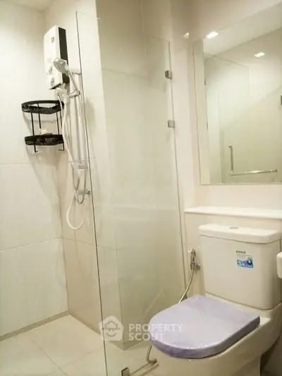 Modern bathroom with glass shower and sleek fixtures