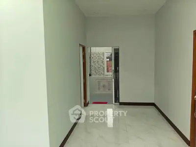 Spacious hallway with glossy tiled floor and modern design