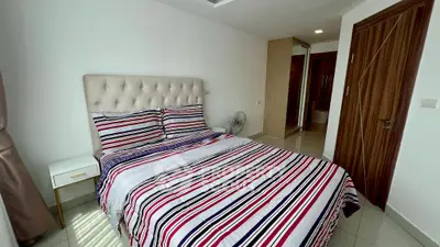 Cozy bedroom with striped bedding and modern decor