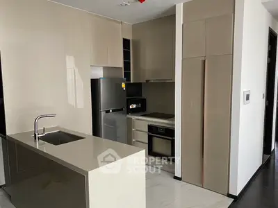 Modern kitchen with sleek cabinetry, stainless steel appliances, and a stylish island.