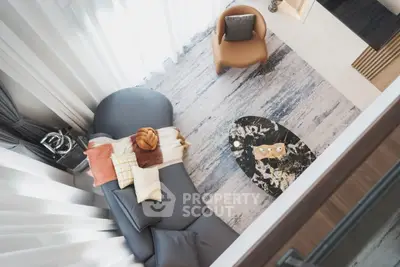 Stylish modern living room with elegant furniture and chic decor from a high angle view.