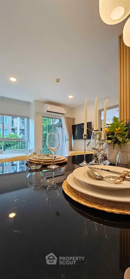 Elegant dining area with modern decor and large windows offering a scenic view, perfect for entertaining guests.
