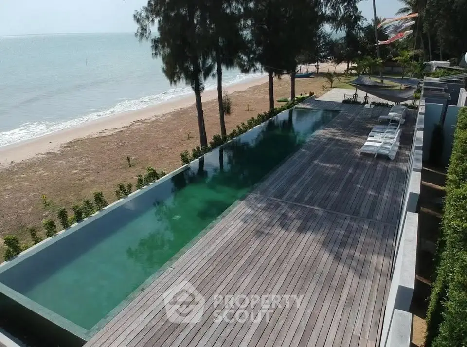 Stunning beachfront pool with expansive deck and ocean view