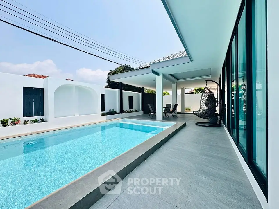 Luxurious modern villa with private pool and spacious patio, perfect for relaxation and entertainment.
