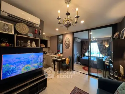 Modern living room with open kitchen and view into cozy bedroom
