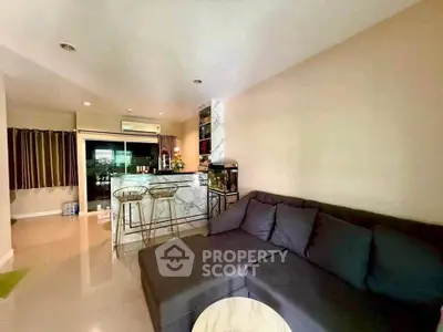 Modern living room with sleek bar and cozy sectional sofa