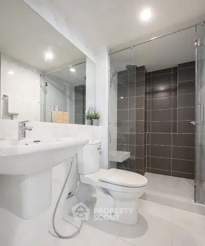 Modern bathroom with sleek design and glass shower enclosure