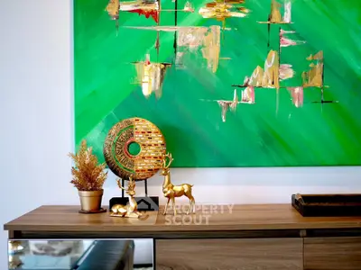 Stylish living room with modern decor and vibrant green abstract art