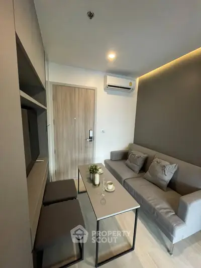 Modern living room with sleek furniture and neutral tones, perfect for urban living.
