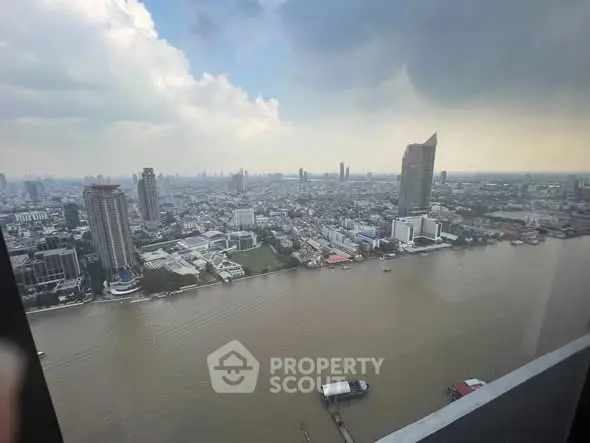 Stunning cityscape river view from high-rise building, perfect for urban living enthusiasts.