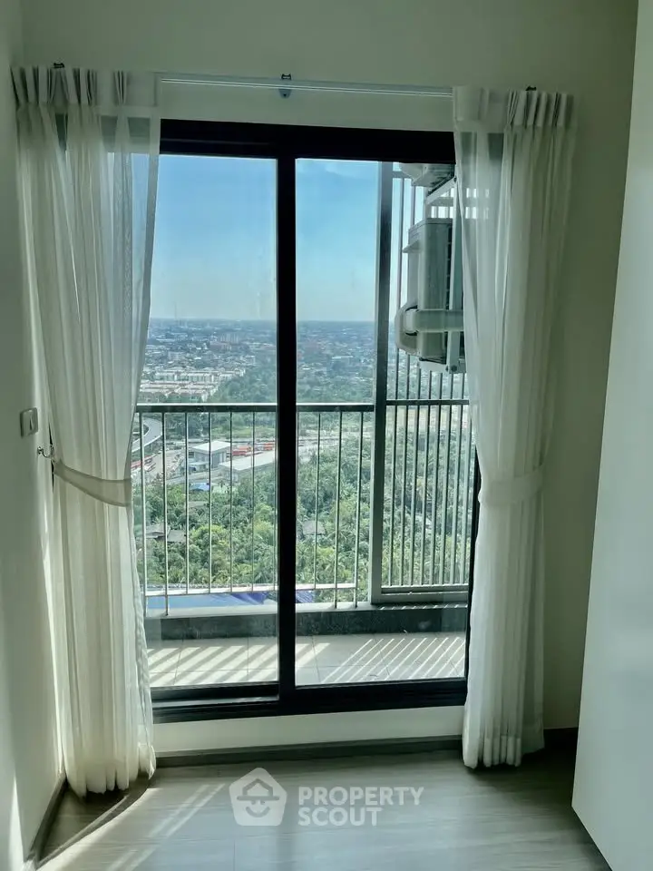 Stunning high-rise apartment with floor-to-ceiling windows and breathtaking city view.