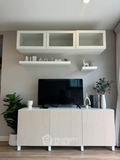 Modern living room with stylish TV stand and decorative shelves