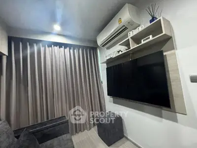 Modern living room with sleek air conditioning and large TV setup