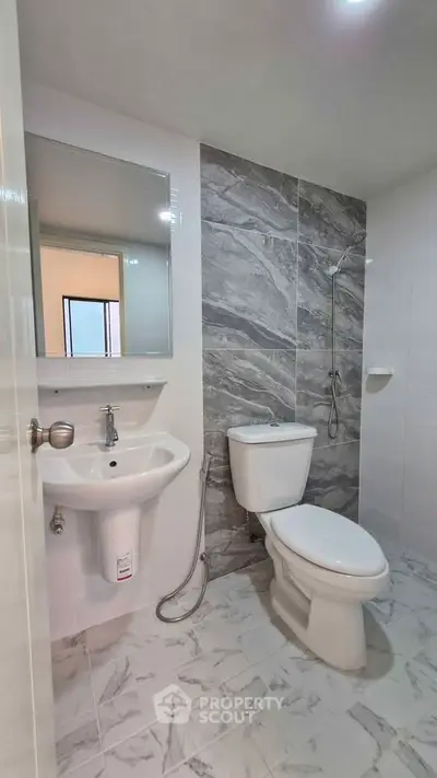 Modern bathroom with sleek design and marble accents