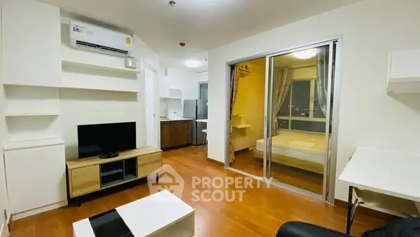 Modern apartment living room with wooden flooring and open layout
