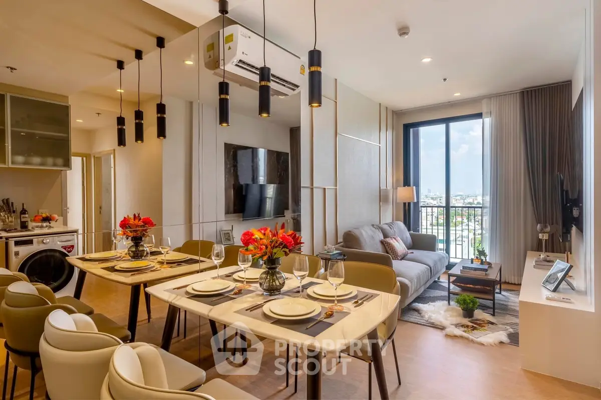 Modern open-layout living room with dining area and balcony view in a stylish apartment.