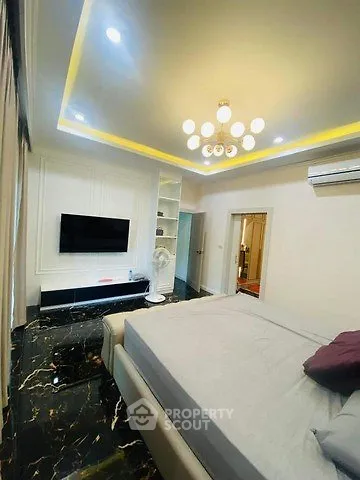 Luxurious bedroom with modern lighting and marble flooring