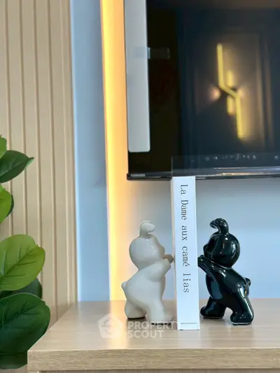 Modern interior with decorative bookends and ambient lighting