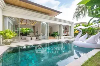 Luxurious villa with private pool and modern open living area, perfect for tropical retreats.