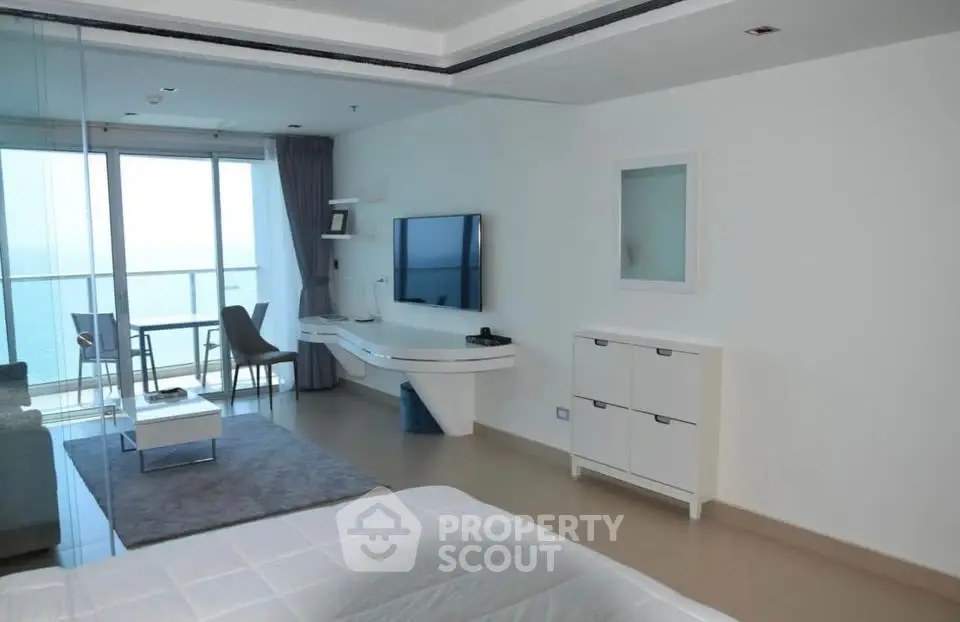 Luxurious modern living room with ocean view and sleek interior design
