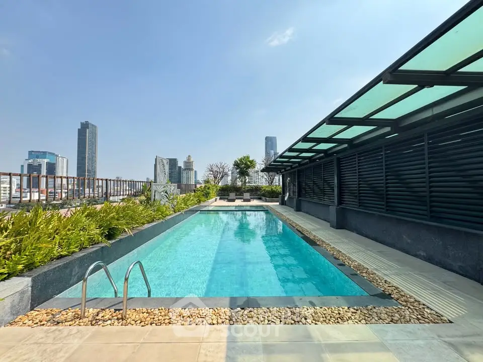 Luxurious rooftop pool with stunning city skyline views and modern design.