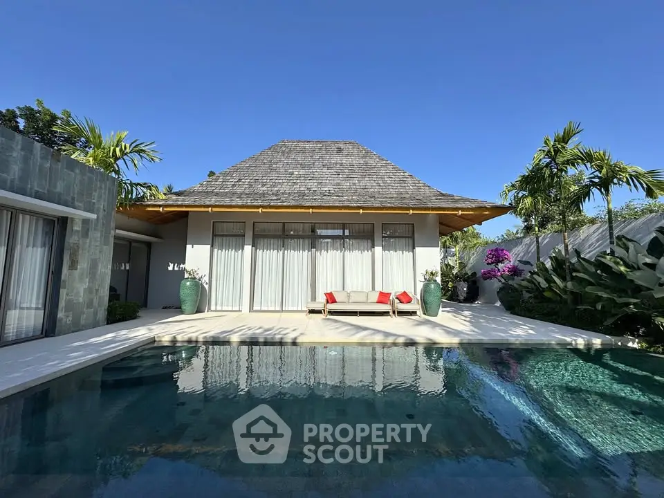 Luxurious villa with private pool and tropical garden, perfect for serene living.