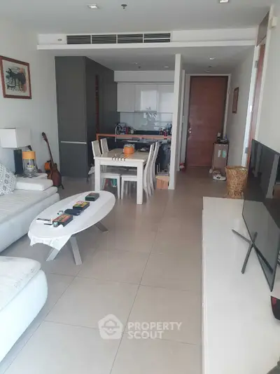 Modern living room with open kitchen and stylish decor