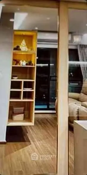 Modern living room with wooden flooring and stylish shelving unit