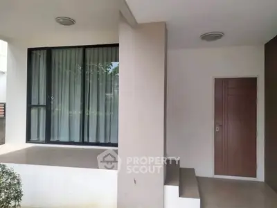 Modern exterior with minimalist design and large window, ideal for contemporary living.