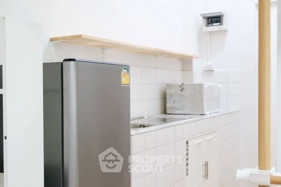 Modern kitchen with sleek appliances and minimalist design