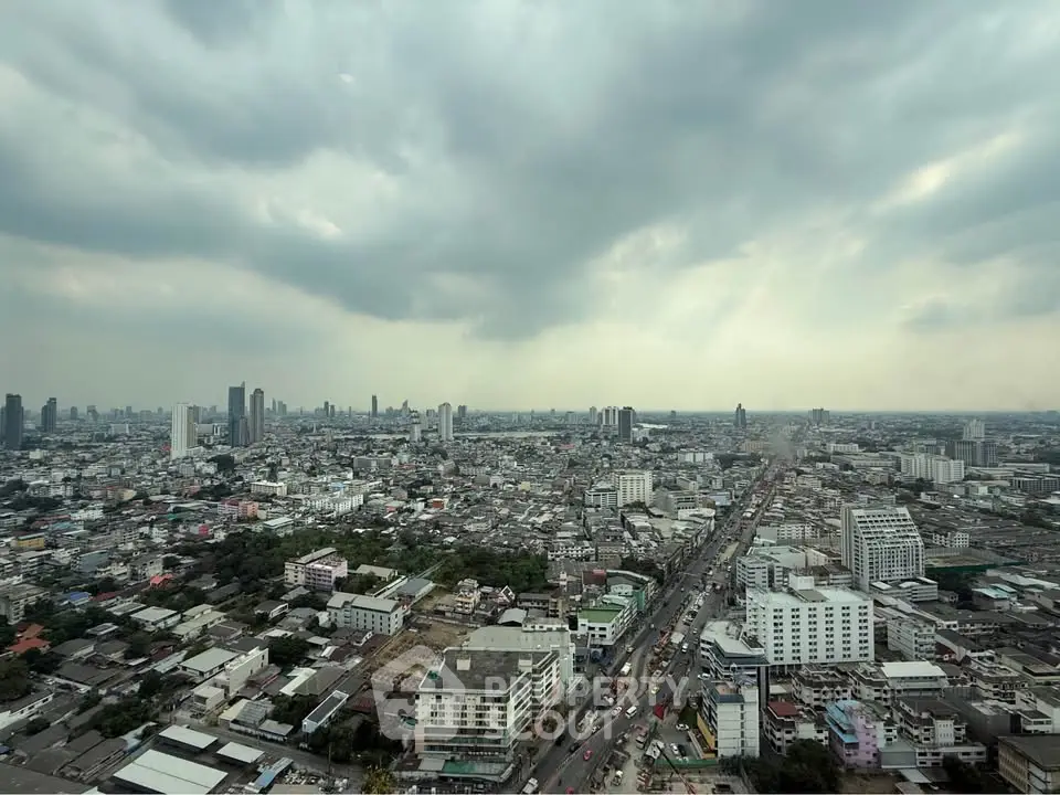 Stunning cityscape view showcasing urban skyline under dramatic cloudy skies.