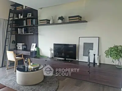 Modern living room with stylish shelving, TV unit, and cozy workspace