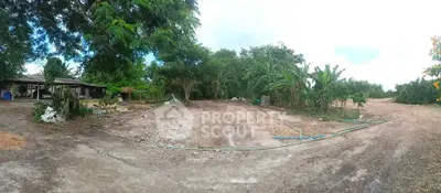 Expansive rural land with lush greenery and potential for development.