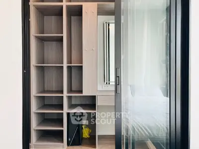 Modern bedroom with sliding glass door and built-in storage unit