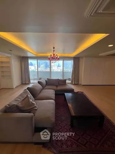 Luxurious living room with stunning city view and elegant chandelier