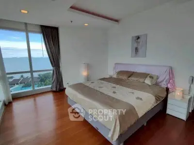 Spacious bedroom with stunning sea view and elegant decor