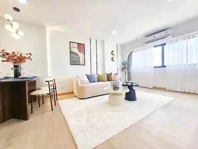 Spacious modern living room with elegant decor and natural light
