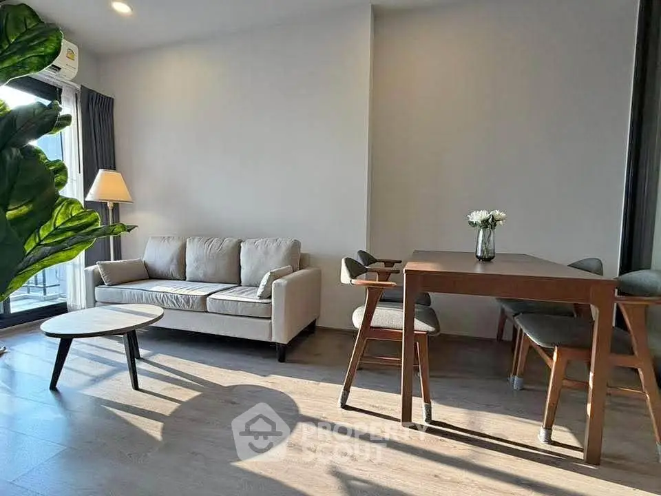 Modern living room with stylish furniture and natural light