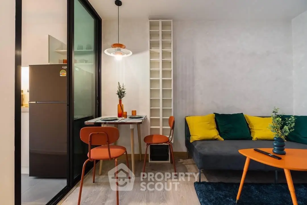 Stylish modern living room with vibrant decor and compact dining area, perfect for urban living.