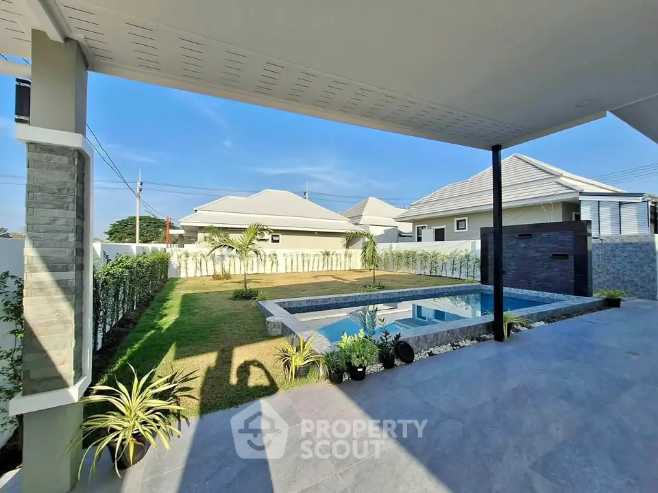Stunning modern backyard with pool and landscaped garden in a serene neighborhood.