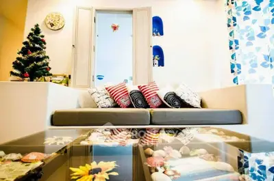 Stylish living room with cozy sofa and decorative glass table