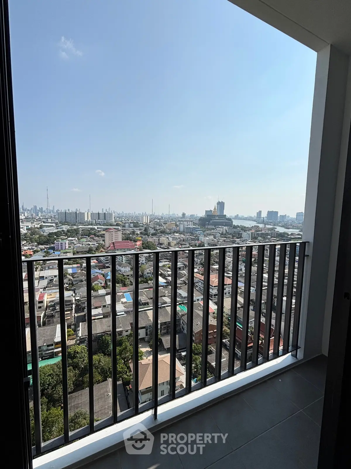 Stunning cityscape view from a modern high-rise balcony, perfect for urban living enthusiasts.