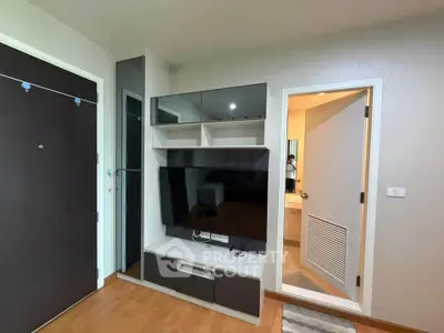 Modern living room with sleek TV unit and wooden flooring
