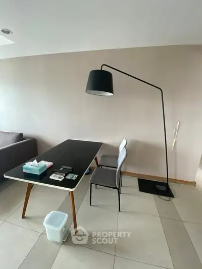 Modern minimalist living room with sleek furniture and stylish floor lamp