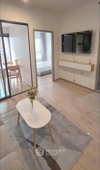 Modern living room with stylish decor and wall-mounted TV