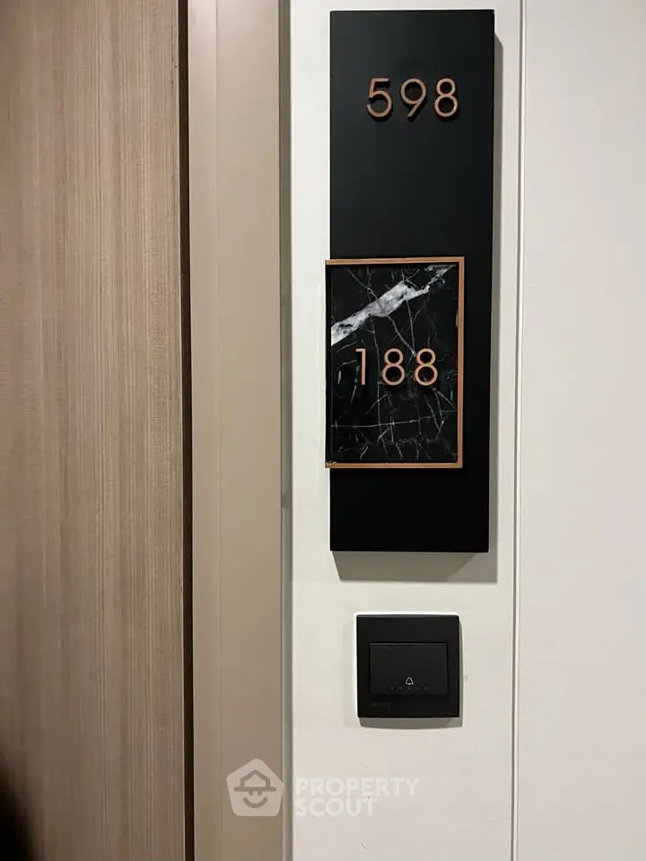 Modern apartment door with stylish number plaque and sleek design