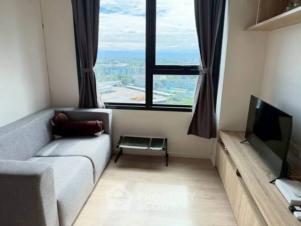 Cozy living room with panoramic city view and modern furnishings