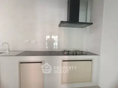 Modern kitchen with sleek gas stove and minimalist design