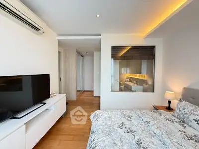 Modern bedroom with stylish decor and large window overlooking bathroom