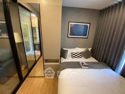 Cozy modern bedroom with stylish decor and mirrored wardrobe